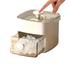 Beige ice cube tray with clear lid and white ice cubes on a white background