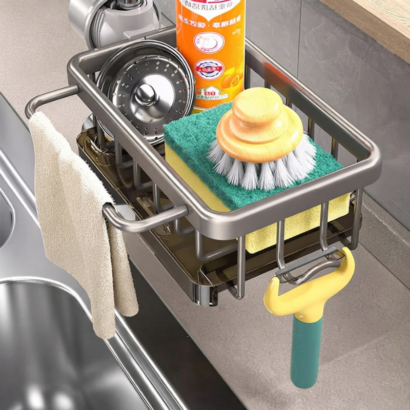 Kitchen sink caddy with sponge, brush, and dish soap holder on a kitchen counter.