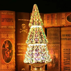 A decorative glass candle holder shaped like a tiered Christmas tree, glowing with multicolored iridescent reflections, set against a background of vintage pirate-style books.