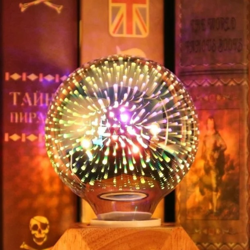 A glowing crystal ball lamp with multicolored light projections sitting on a wooden pedestal in front of a dark, vintage-themed bookshelf background.