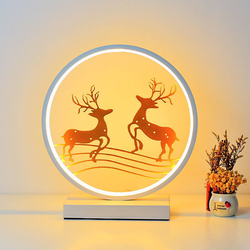 Decorative lamp with deer design on a neutral background