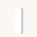 A minimalist, vertically oriented rectangular light fixture with rounded ends, shown against a solid off-white background.