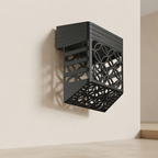 Black wall-mounted decorative bracket on a beige wall