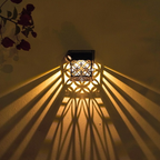 Decorative wall light casting shadows on a wall