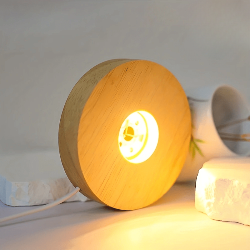 Wooden lamp with a warm glow on a white surface