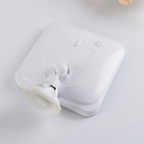 A white square wall-mounted suction cup holder with a clear suction cup attachment, shown on a plain light background.