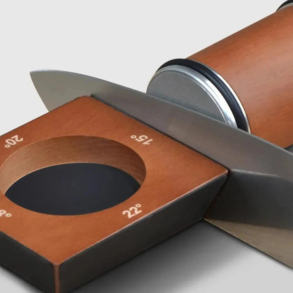Knife with a wooden handle and metal blade on a gray background