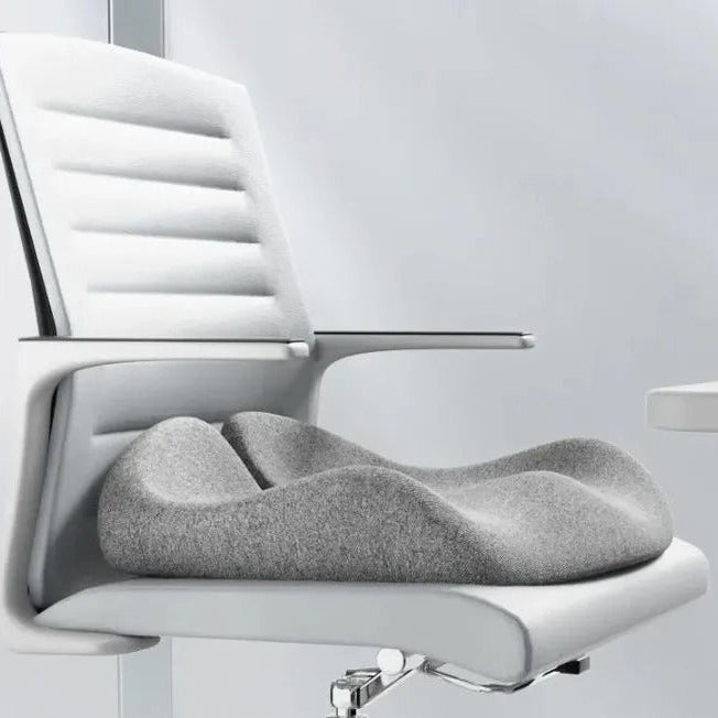 Gray cushion on a white office chair with a light gray background