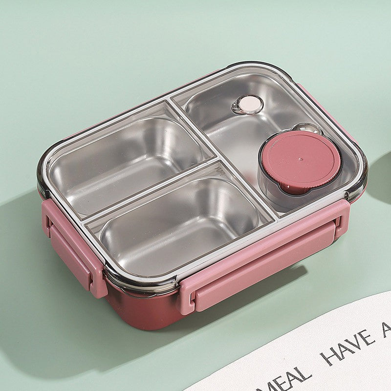 Pink and silver bento box on a light green background