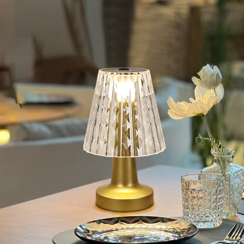 Decorative table lamp on a table with a blurred background
