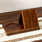 Wooden phone stand on a woven mat