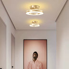 Modern ceiling lights in a room with a framed picture on the wall.
