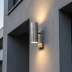 Modern outdoor wall light fixture on a concrete building.