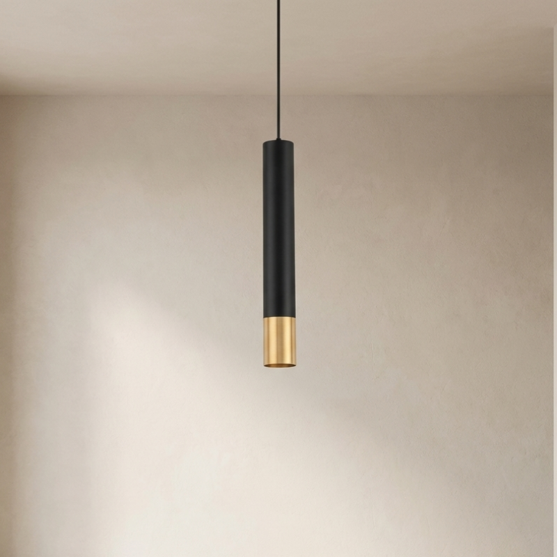 Modern pendant light with black and gold design hanging in a neutral setting