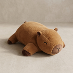 Brown plush hippo toy on a beige background