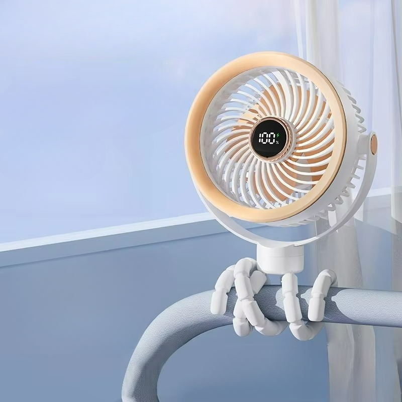 Portable fan with digital display attached to a chair armrest against a light blue wall.