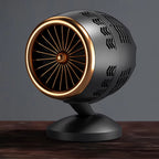 Decorative object resembling a jet engine on a wooden surface with a dark background
