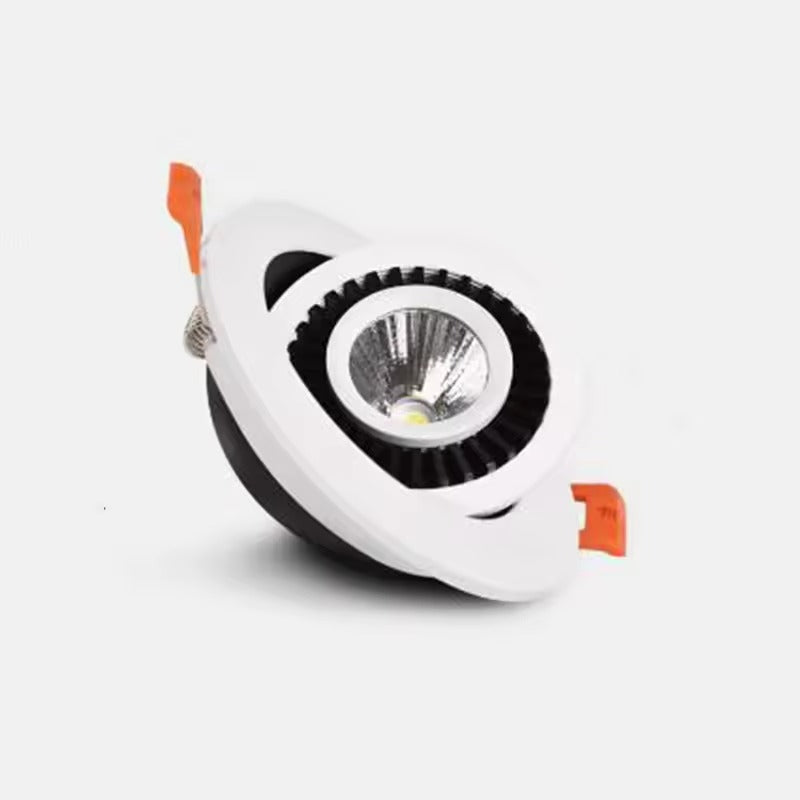 White and black spotlight with orange accents on a light gray background