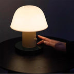 Hand adjusting a lamp with text indicating brightness control
