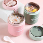 Stainless steel food containers with food inside on a pink background