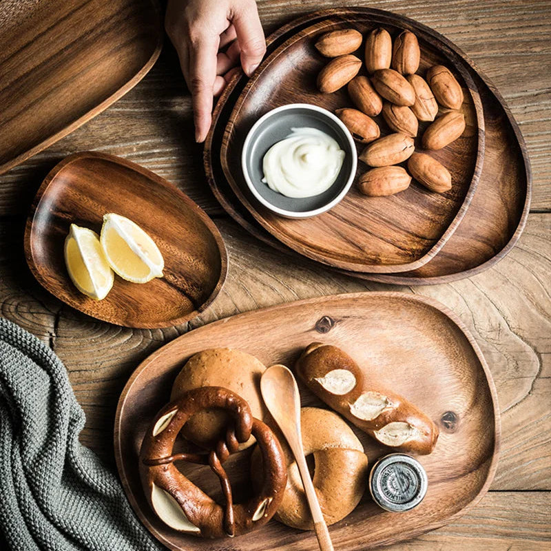 Wooden trays with food on a wooden table