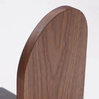 Close-up of a wooden chair backrest on a white background