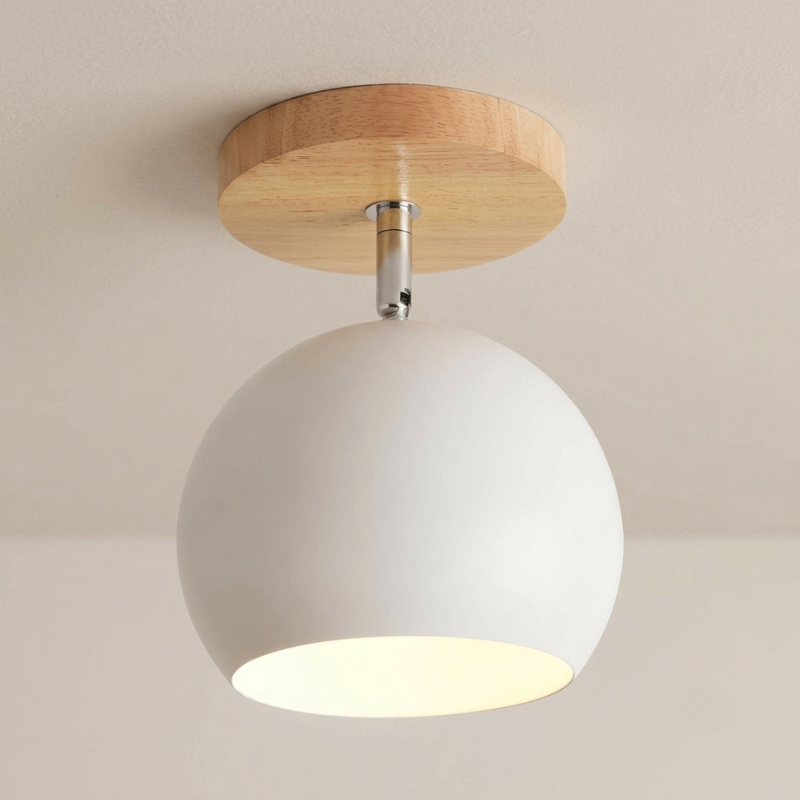 A modern semi-flush mount ceiling light fixture featuring a large white spherical shade, a natural wood circular canopy, and a silver metal stem, shown illuminated against a neutral beige ceiling.