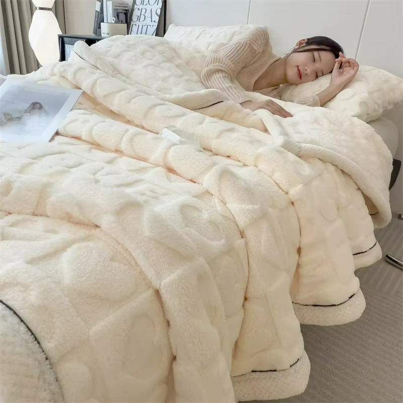 Woman lying in bed under a fluffy beige comforter in a cozy bedroom.