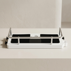 White and black kitchen appliance on a light gray background