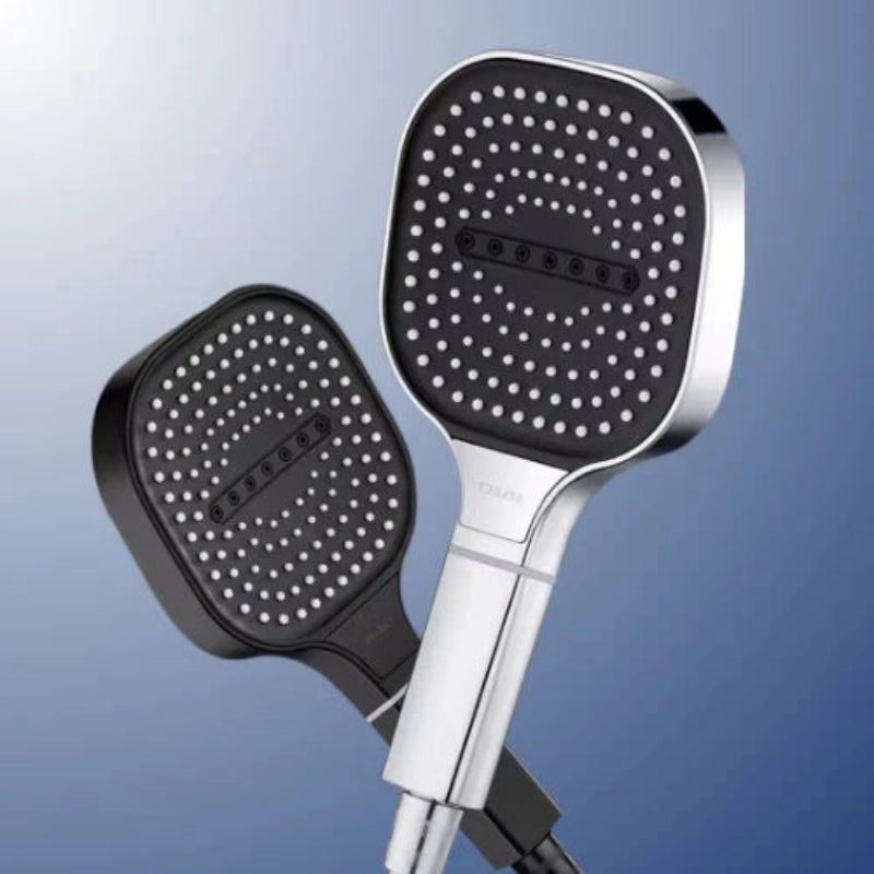 Two shower heads with black nozzles on a blue gradient background