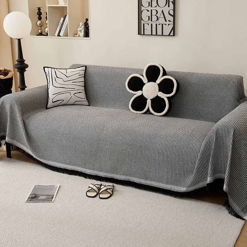 Gray sofa with decorative pillows in a living room setting