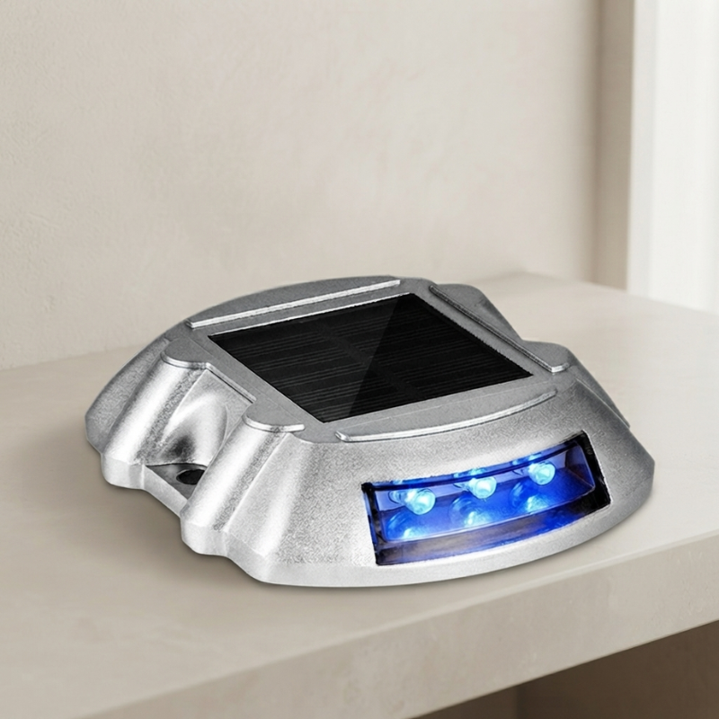 Solar-powered dock light with blue LEDs on a white surface
