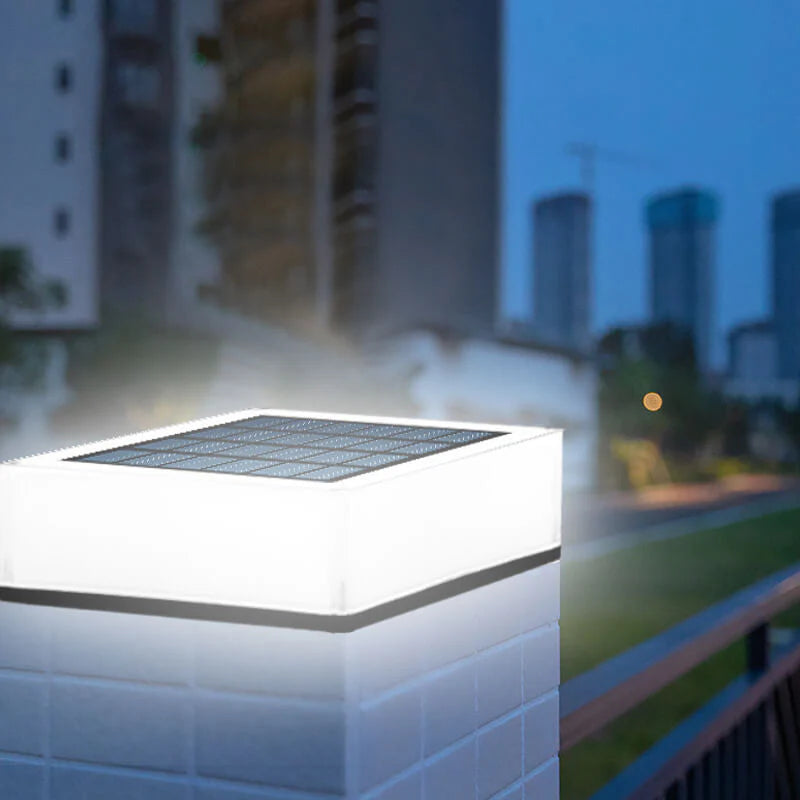 Solar light on a wall with a cityscape in the background