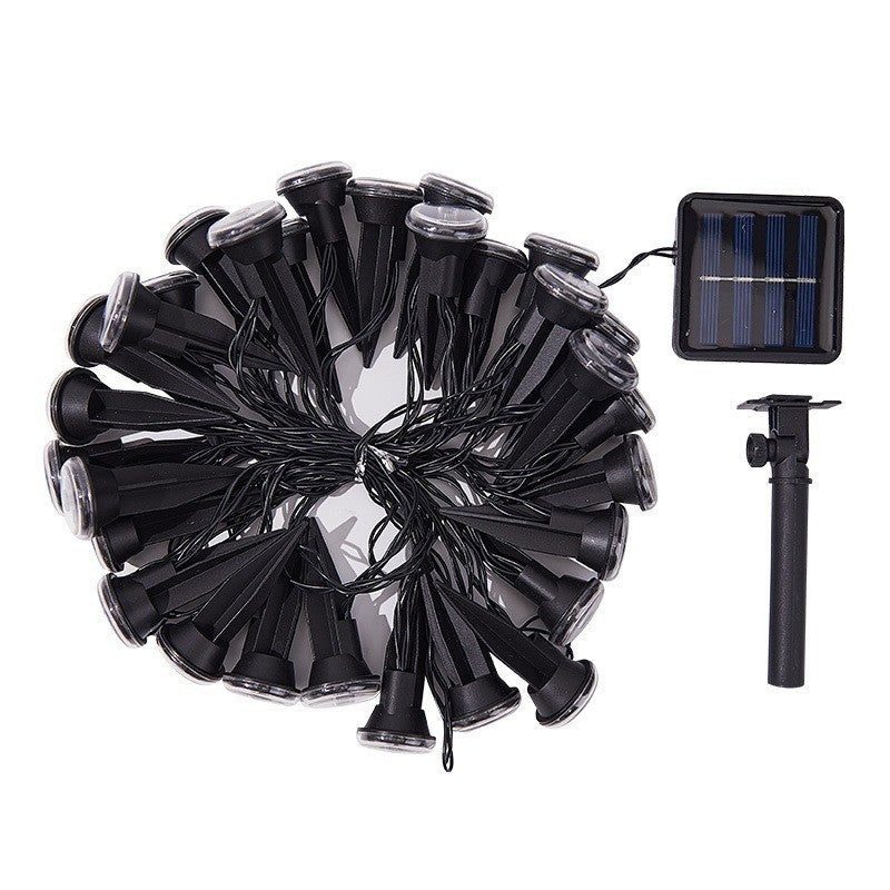 Black solar string lights with multiple cone-shaped bulbs arranged in a circle, shown with a small rectangular solar panel and a single ground stake on a white background.