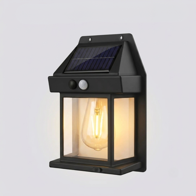 Solar-powered outdoor wall light with a clear glass cover on a gray background