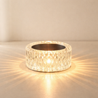 Crystal wall light fixture on a beige wall
