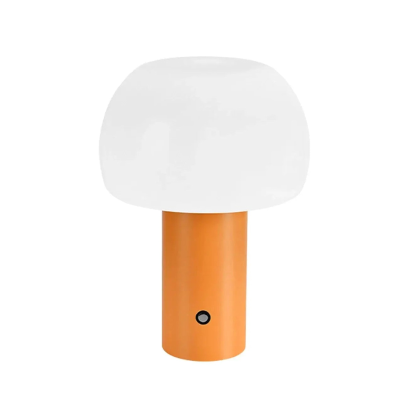 Small lamp with a white shade and orange base on a white background