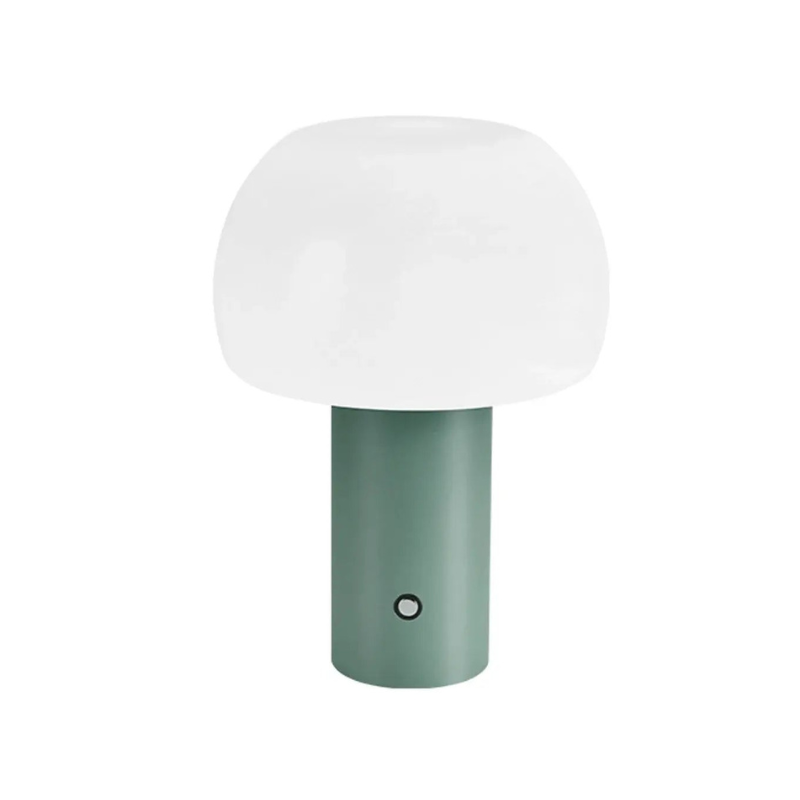 Green lamp with a white shade on a white background