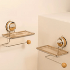 Two glass shelves with metal brackets on a beige wall.