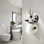Modern bathroom with toilet, sink, and decorative elements.
