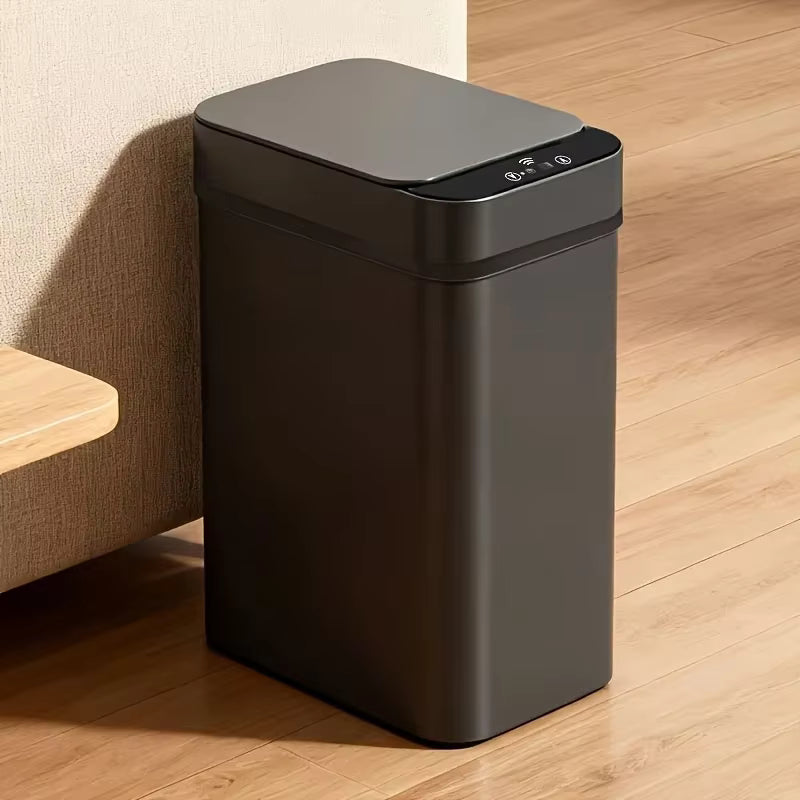 Black trash bin on a wooden floor with a neutral wall background