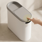 Smart trash can with a hand pressing the lid, set against a neutral background.