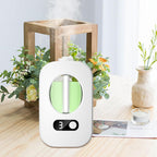 White electronic device with digital display on a wooden surface with plants and a candle.