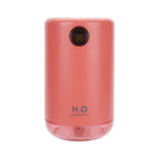 Pink humidifier with digital display on a white background