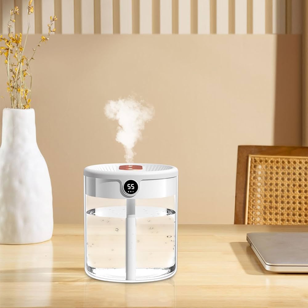 Humidifier on a desk with a vase and laptop in the background
