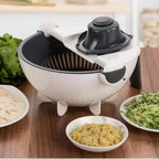 Vegetable chopper on a wooden table with ingredients around