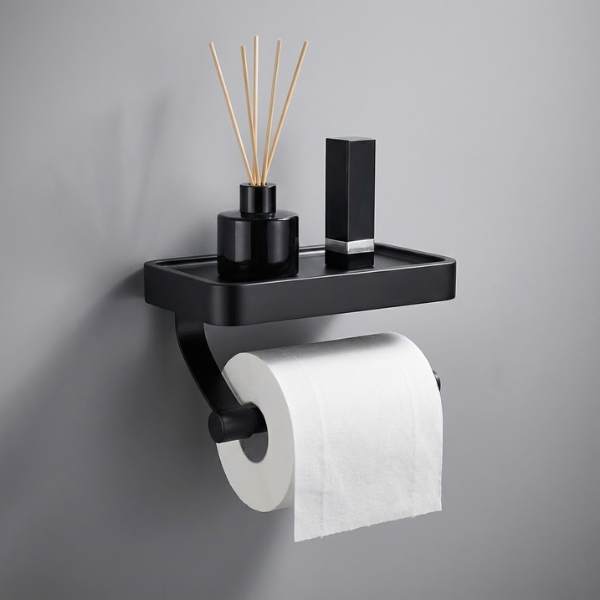 Black bathroom shelf with toilet paper holder and decorative items on a gray background