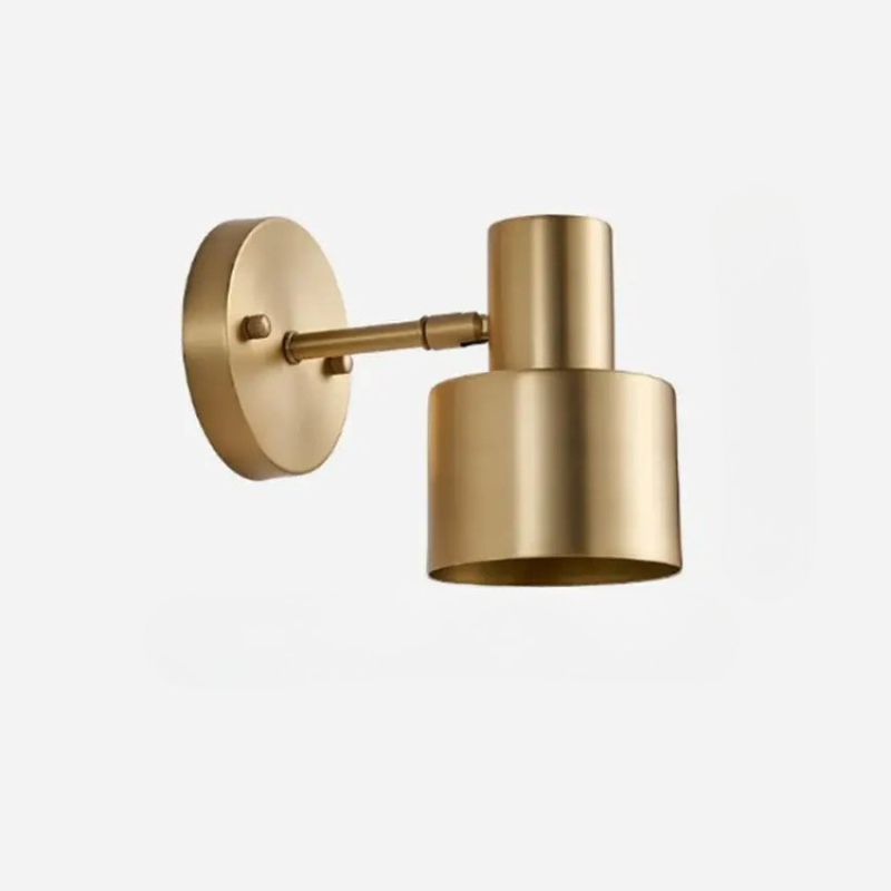 Gold wall-mounted light fixture on a white background