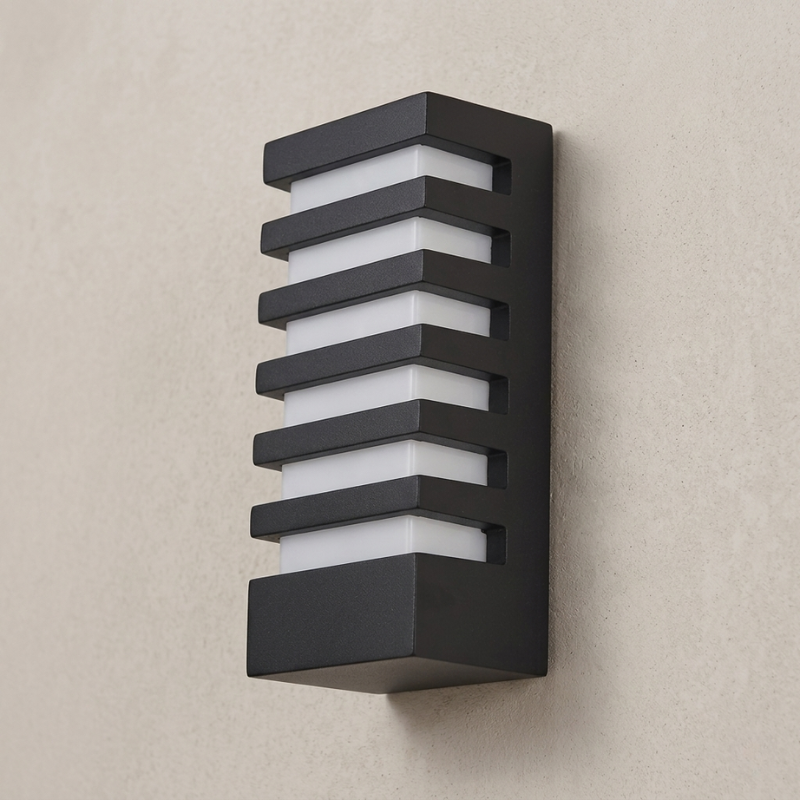 Modern outdoor wall light fixture on a beige wall