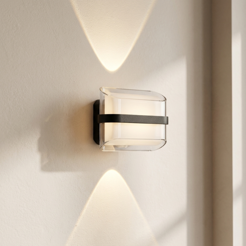 Modern wall-mounted light fixture on a neutral wall